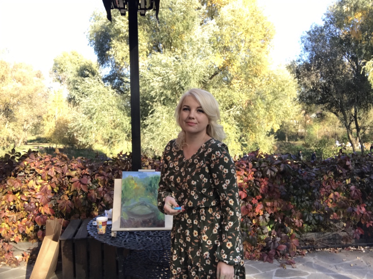 Artist Marina Stognieva painting autumn on the terrace of Radomysl Castle